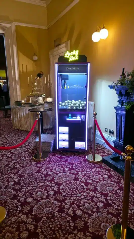 Entertainment setup with prize machine and display lights, featured in vendor listing card.