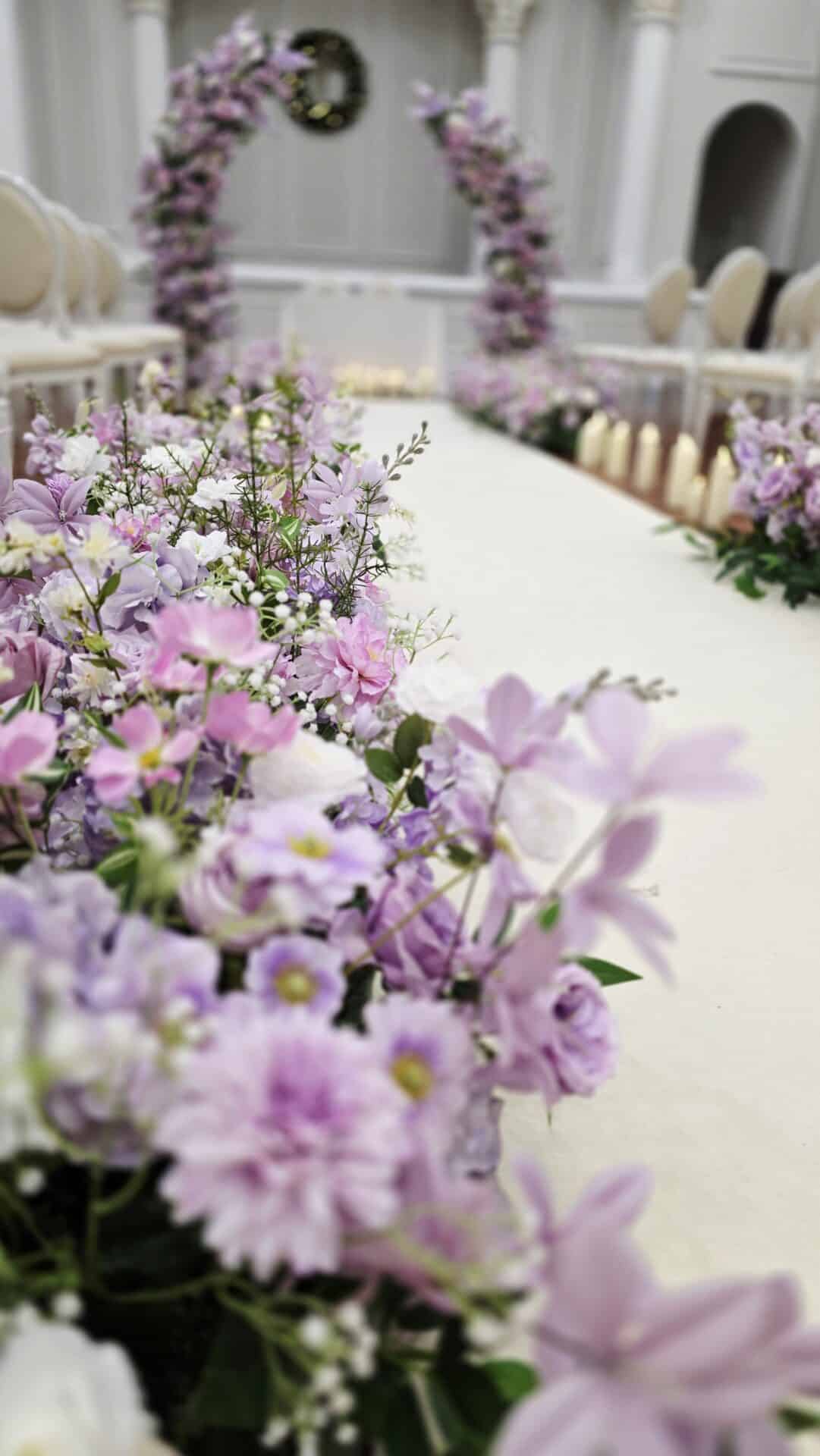 Stunning Purple and Lilac Floral wedding ceremony setup at Tullyglass Hotel, Northern Ireland