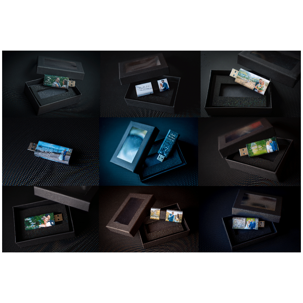 Custom USB drives with personalized photos in black boxes, arranged in a grid on a textured surface.