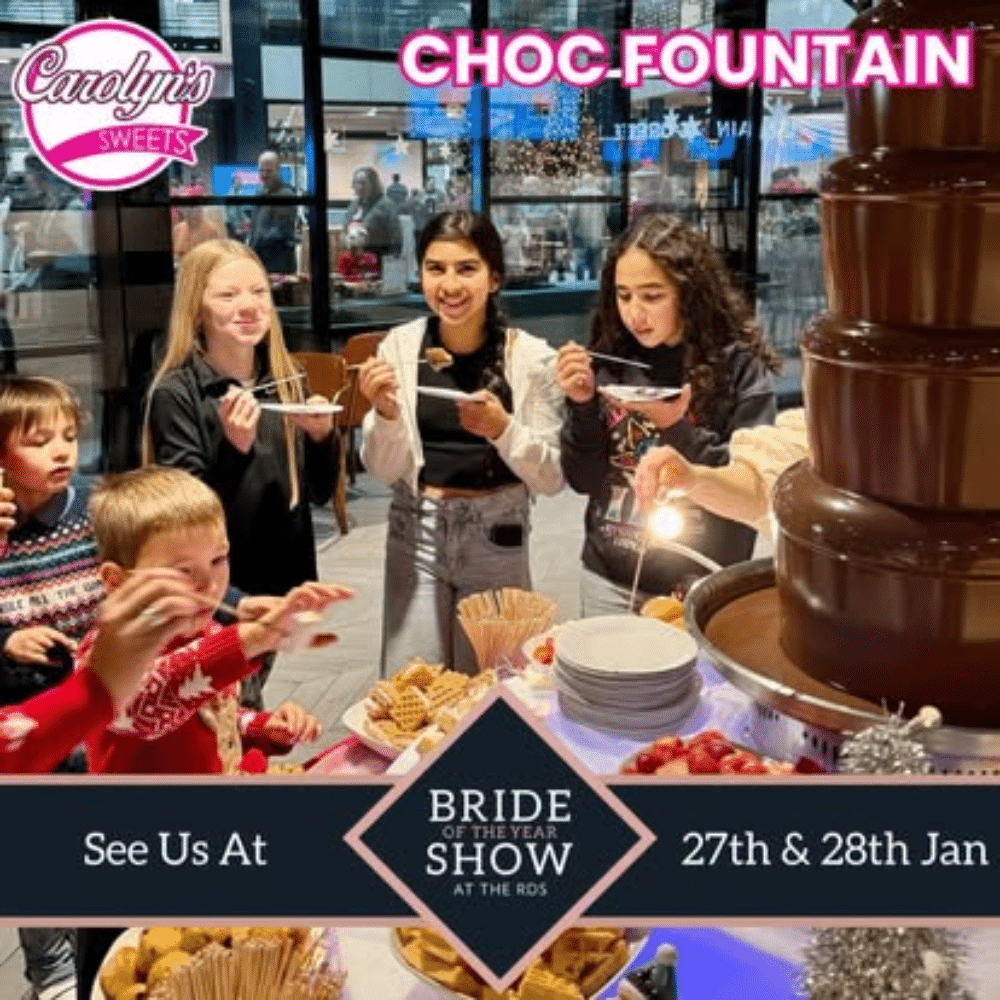 People enjoying a chocolate fountain at Carolyn's Sweets booth, Bride of the Year Show, 27th & 28th Jan.