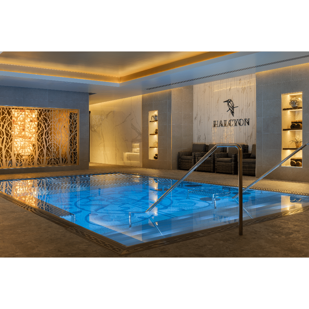 Luxurious indoor spa pool with ambient lighting and elegant decor.