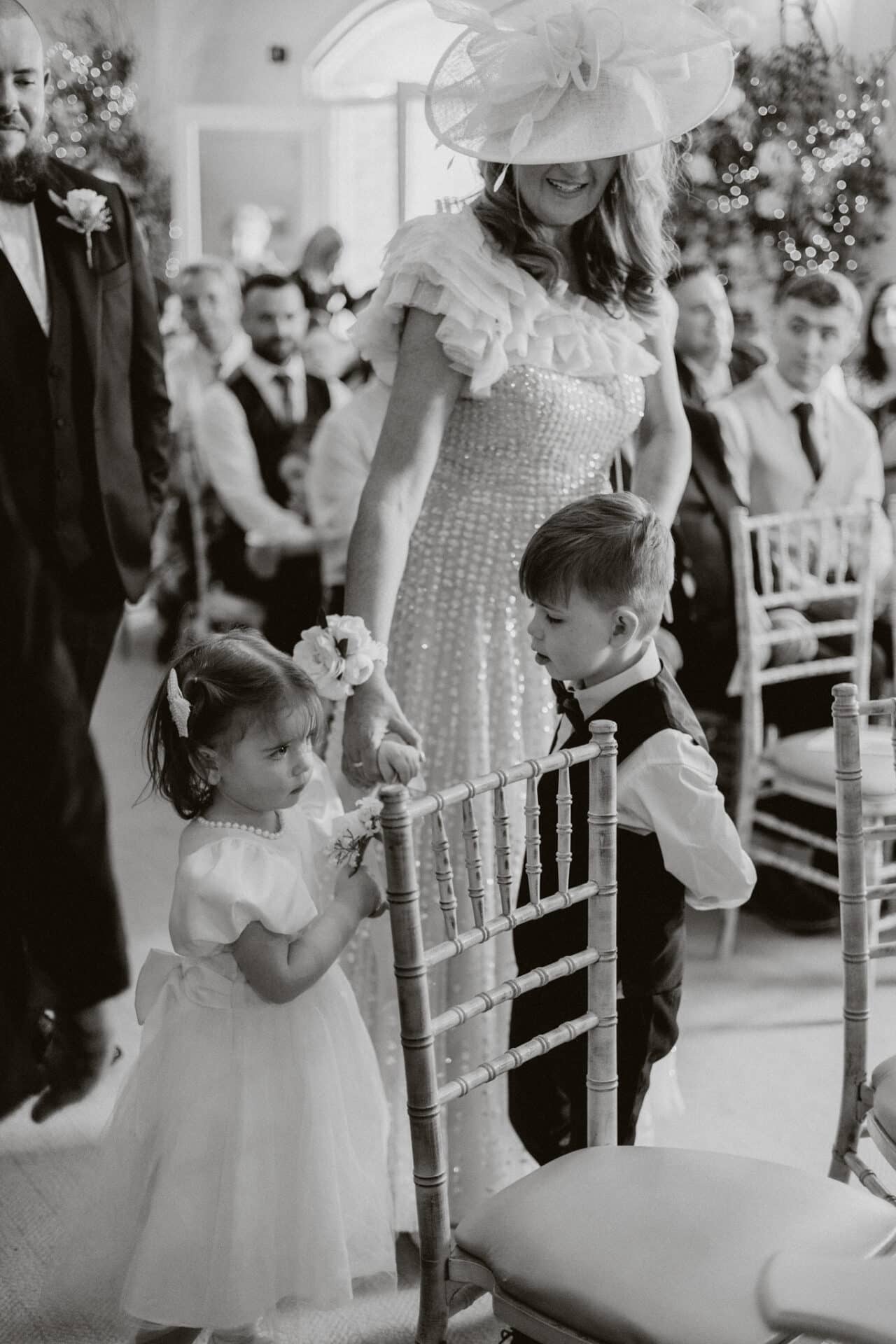 Natalie and Stephen’s children make their way down the aisle during their Darver Castle wedding ceremony, surrounded by family and guests.