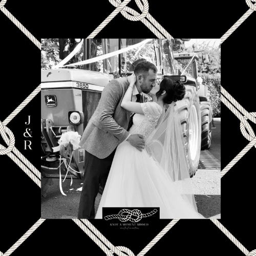 Bride and groom kiss in front of a tractor, framed by a rope design.