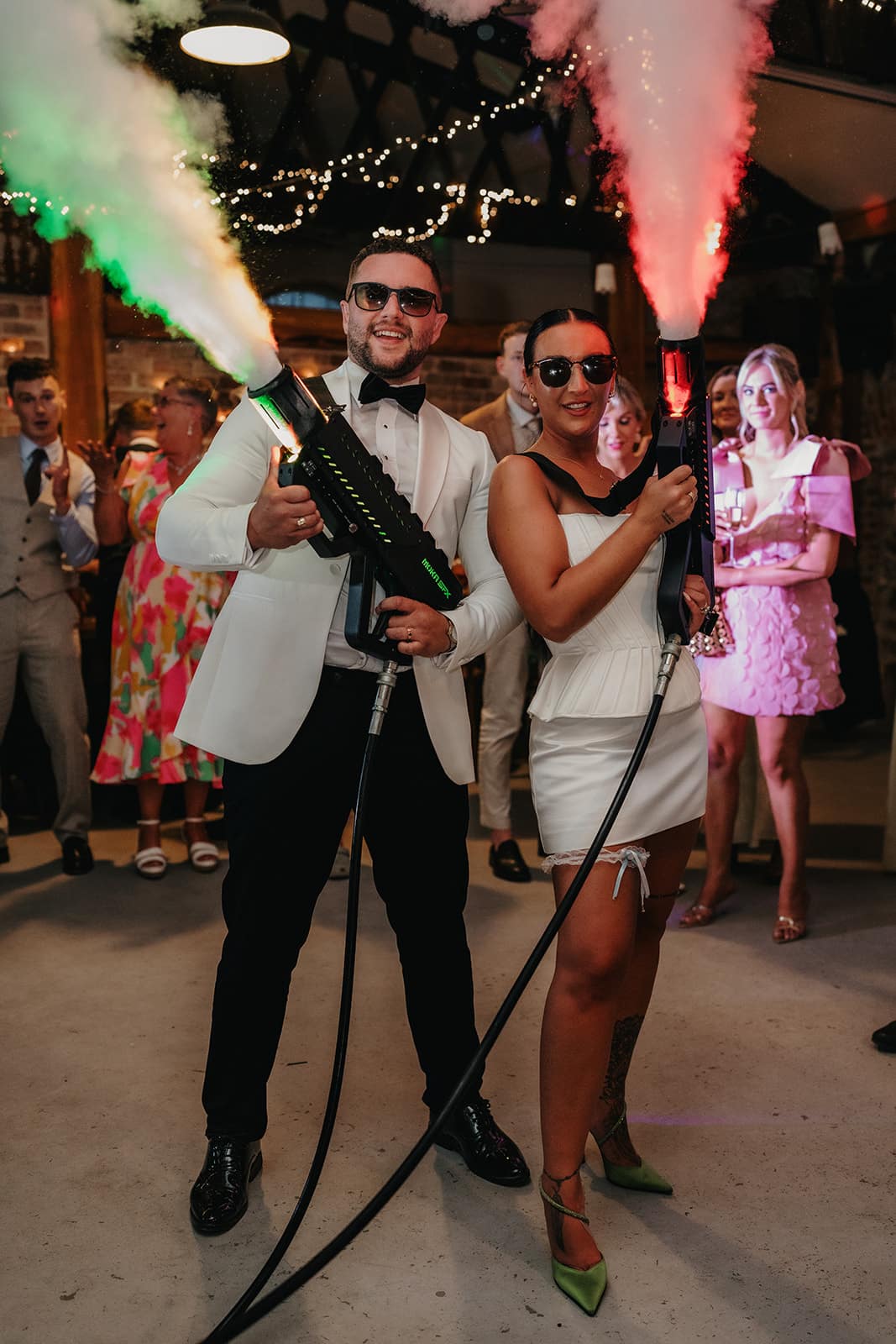 Newlyweds holding and blasting Co2 Guns in Limepark Wedding Venue in Northern Ireland