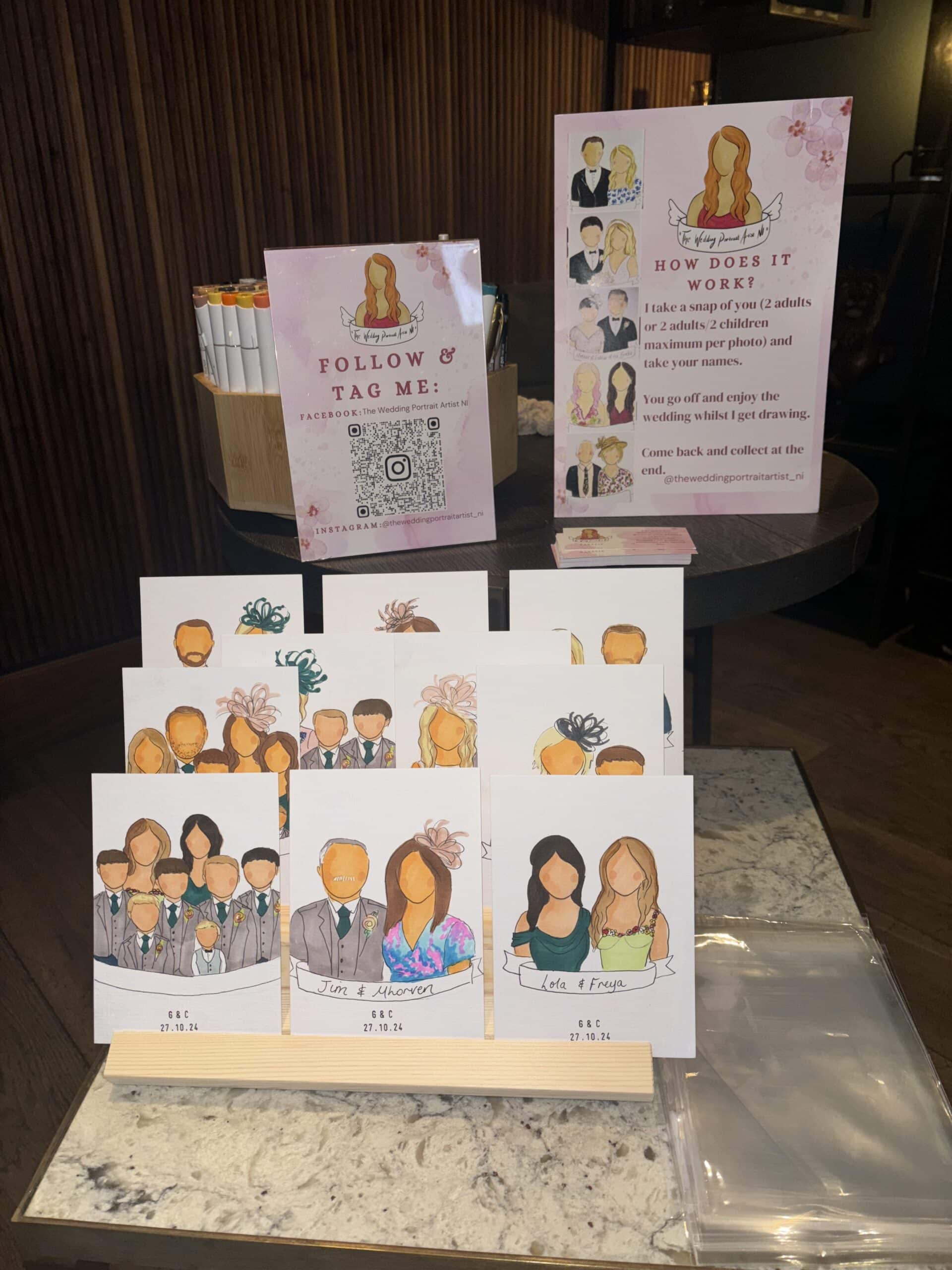 Illustrated wedding portraits display with social media and QR code signage on a table.